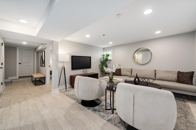 living room with light hardwood / wood-style flooring