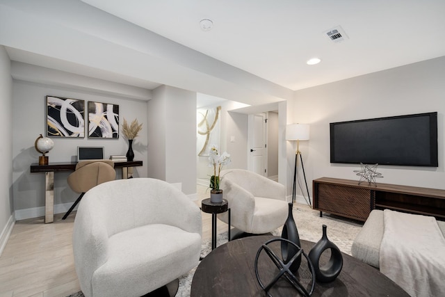 living room with light hardwood / wood-style flooring