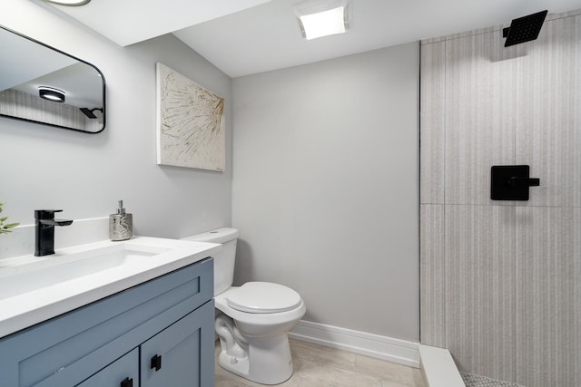 bathroom featuring vanity, toilet, and walk in shower