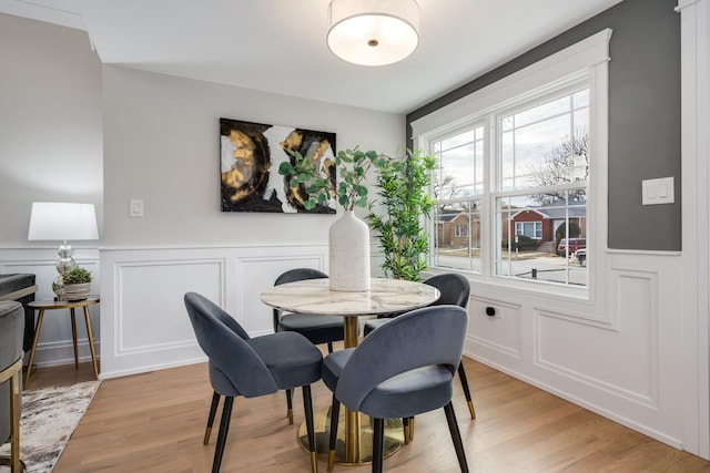 dining area with hardwood / wood-style flooring