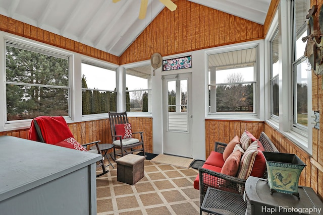 sunroom / solarium with lofted ceiling with beams and ceiling fan