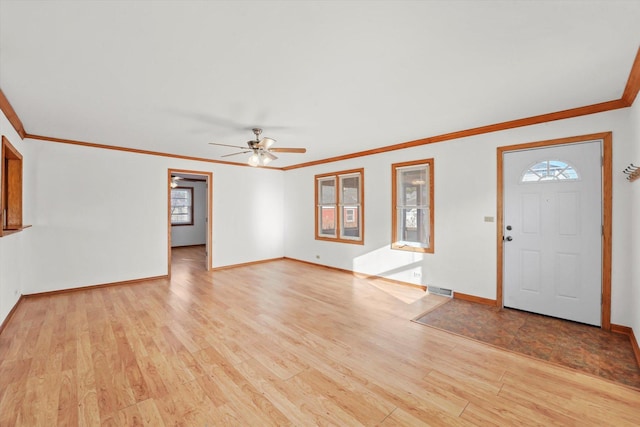 entryway with ceiling fan, light hardwood / wood-style floors, and ornamental molding