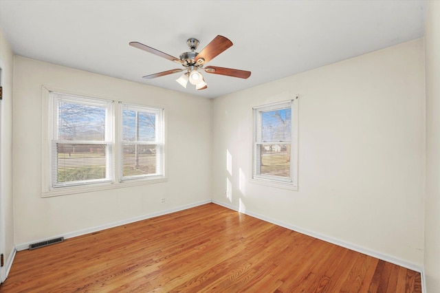 spare room featuring light hardwood / wood-style flooring and ceiling fan