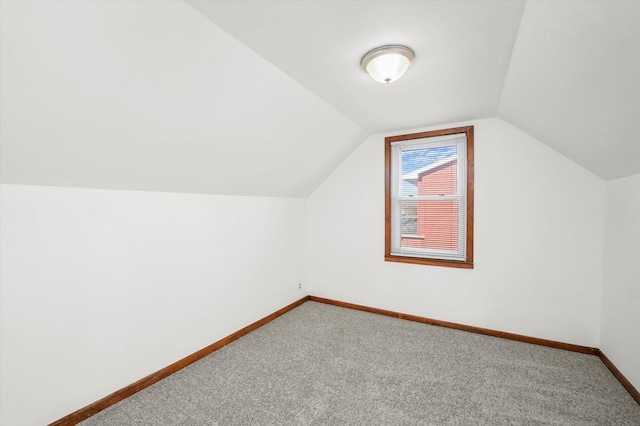 bonus room featuring carpet floors and lofted ceiling