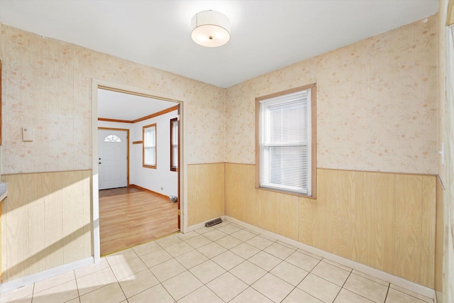 tiled empty room with wooden walls