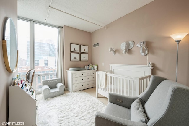 bedroom featuring a crib