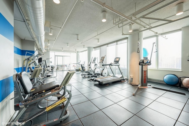 workout area with a textured ceiling