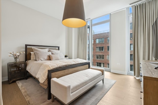 bedroom featuring light wood-type flooring