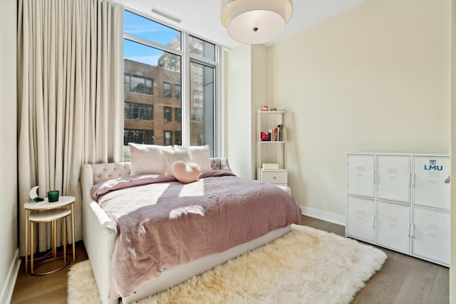 bedroom with hardwood / wood-style flooring