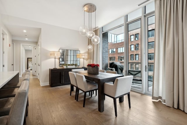 dining area with light hardwood / wood-style flooring