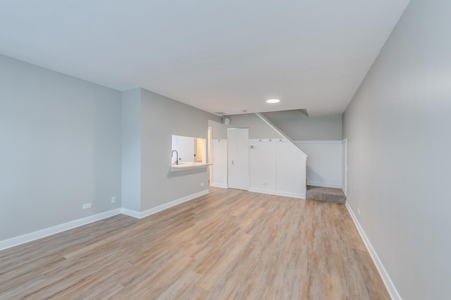 unfurnished living room with light hardwood / wood-style flooring