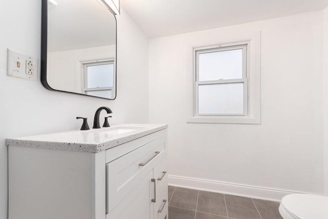 bathroom with tile patterned floors, vanity, and toilet