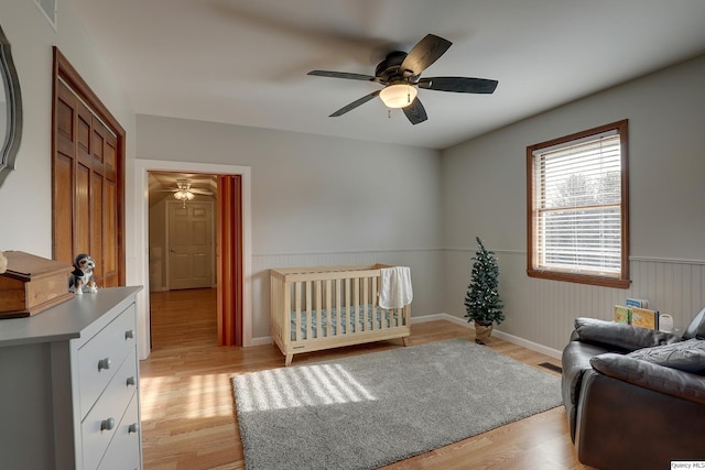 bedroom featuring ceiling fan and light hardwood / wood-style flooring