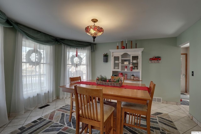 dining room featuring light tile patterned floors