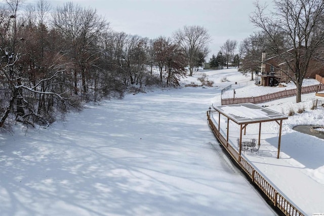 view of yard layered in snow