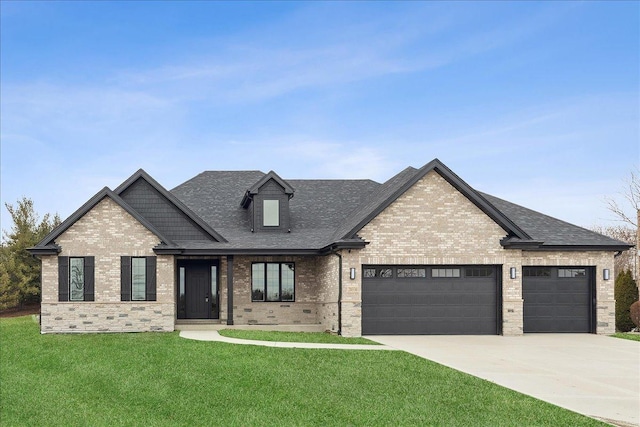 view of front of property with a garage and a front yard