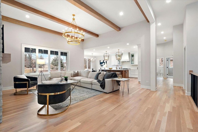 living room featuring sink, light hardwood / wood-style flooring, beam ceiling, a high ceiling, and a notable chandelier