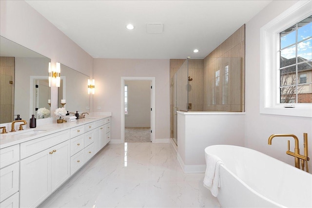 bathroom featuring vanity and shower with separate bathtub