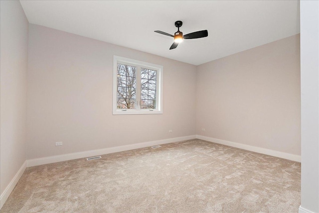 carpeted empty room featuring ceiling fan