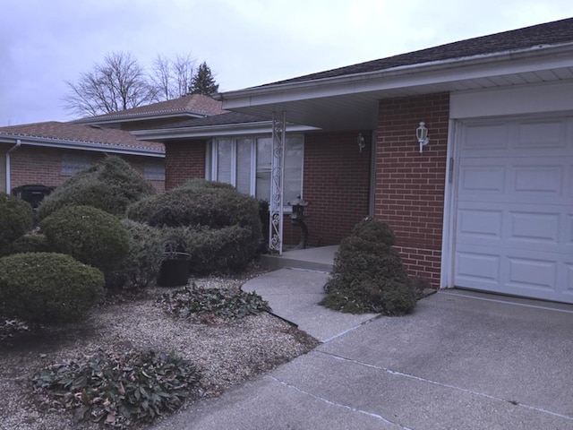 doorway to property with a garage