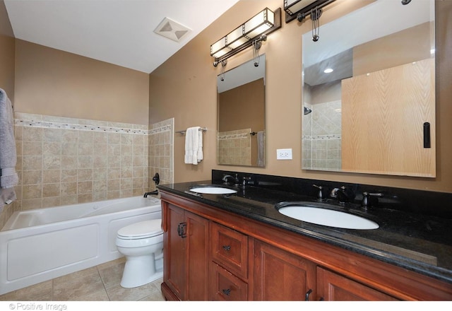 full bathroom with tile patterned floors, vanity, shower / bathtub combination, and toilet