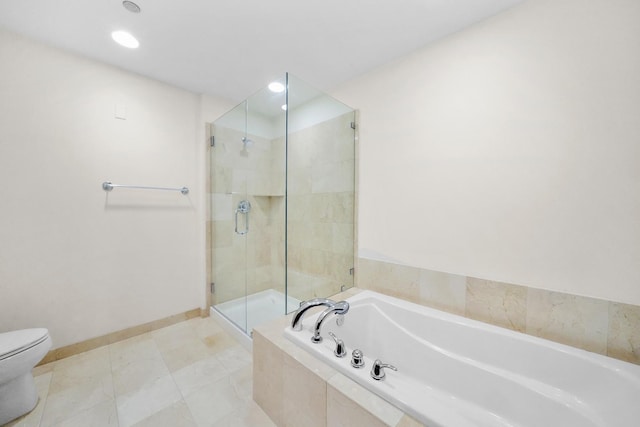 bathroom featuring tile patterned floors, separate shower and tub, and toilet