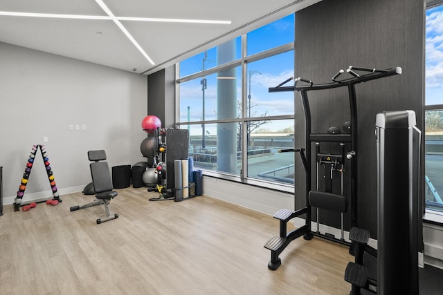 gym with light wood-type flooring