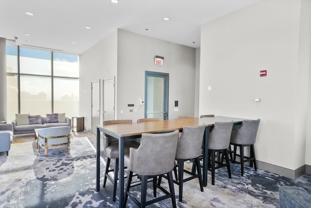 dining space featuring floor to ceiling windows