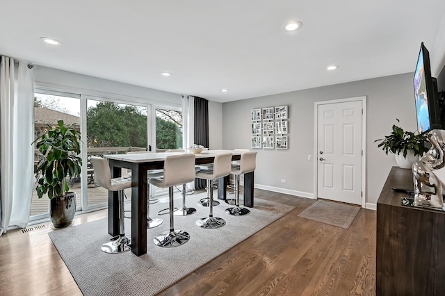 dining room with dark hardwood / wood-style floors