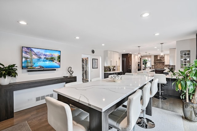 dining room with dark hardwood / wood-style flooring