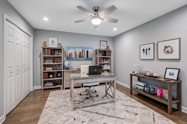 home office featuring wood-type flooring and ceiling fan