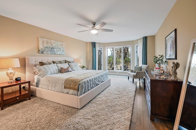 bedroom with ceiling fan and hardwood / wood-style floors