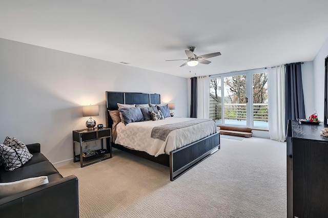 bedroom featuring ceiling fan and light carpet