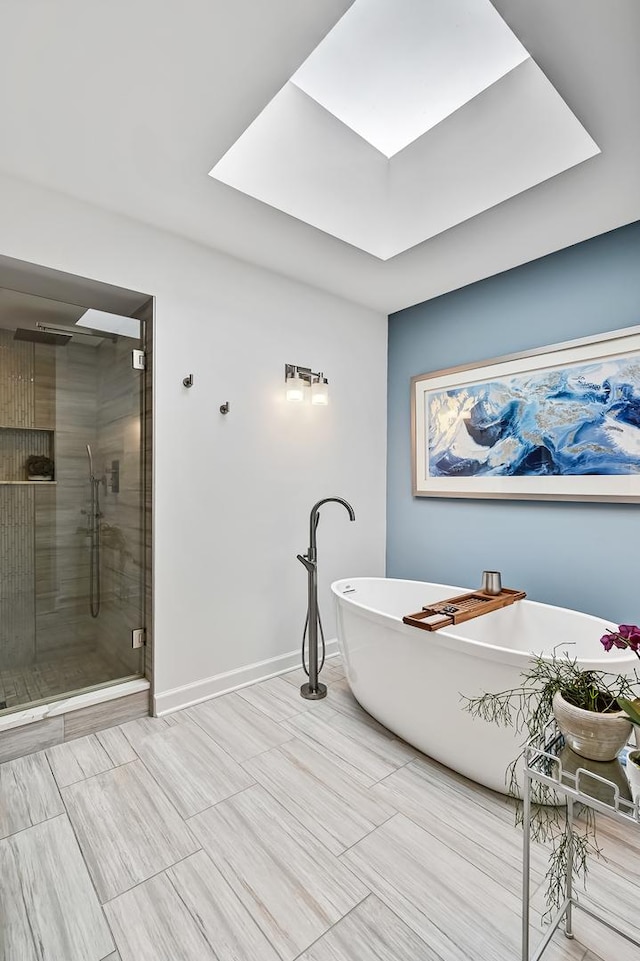 bathroom featuring shower with separate bathtub