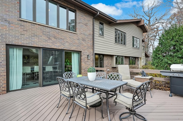 wooden deck with area for grilling