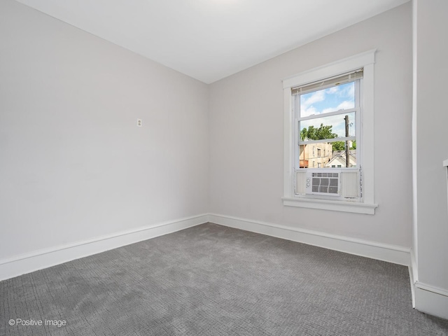 carpeted spare room with cooling unit