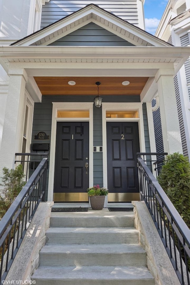 view of exterior entry with a porch