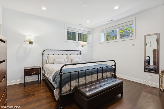 bedroom featuring dark hardwood / wood-style flooring