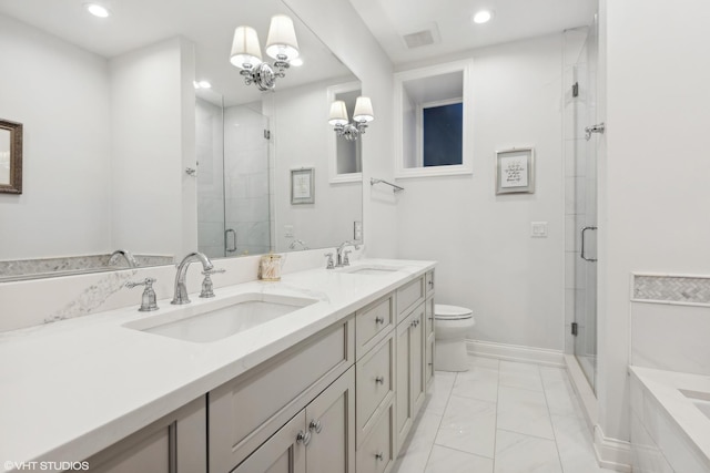 bathroom featuring vanity, toilet, and an enclosed shower