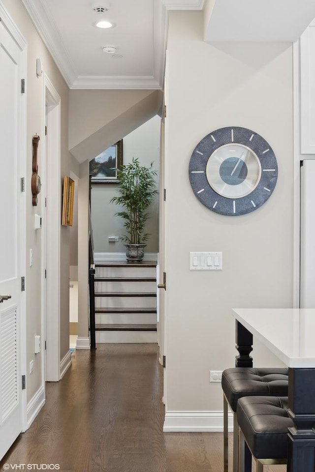 interior space with wood-type flooring and ornamental molding