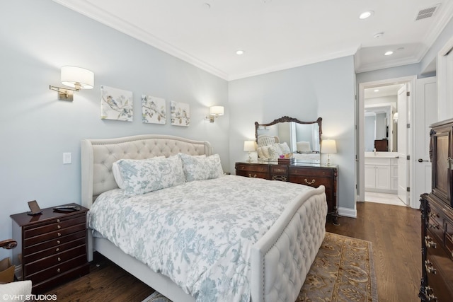 bedroom featuring ensuite bathroom, dark wood-type flooring, and ornamental molding