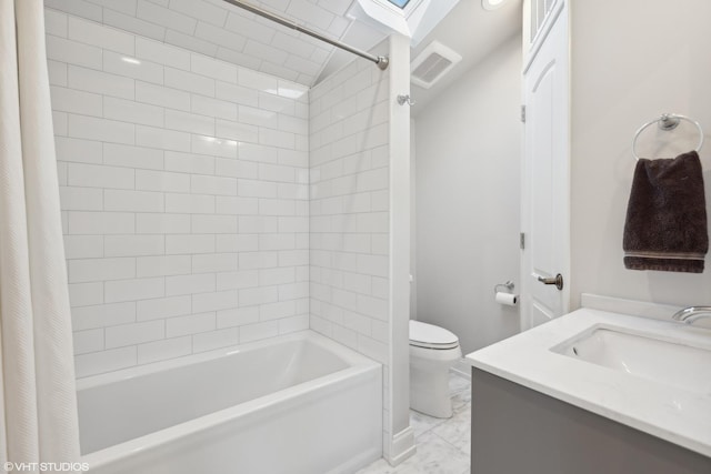 full bathroom featuring vanity, shower / tub combo, and toilet