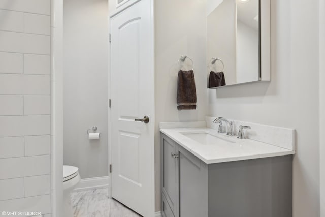 bathroom with vanity and toilet