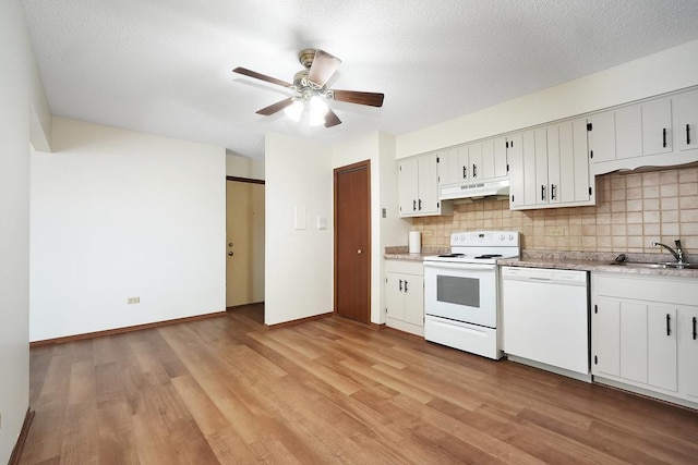 kitchen featuring white cabinetry, white appliances, sink, and tasteful backsplash