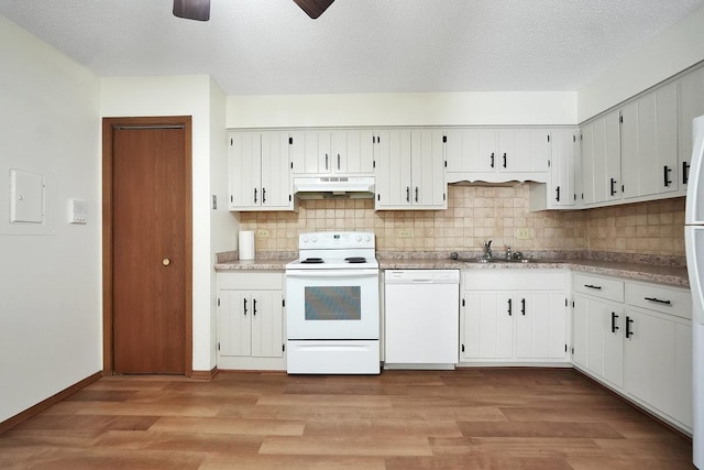 kitchen featuring light wood-type flooring, a textured ceiling, white appliances, sink, and white cabinets