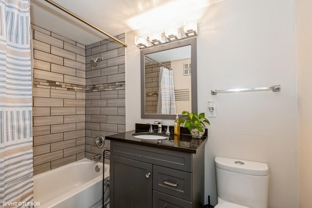 full bathroom featuring toilet, shower / tub combo with curtain, and vanity