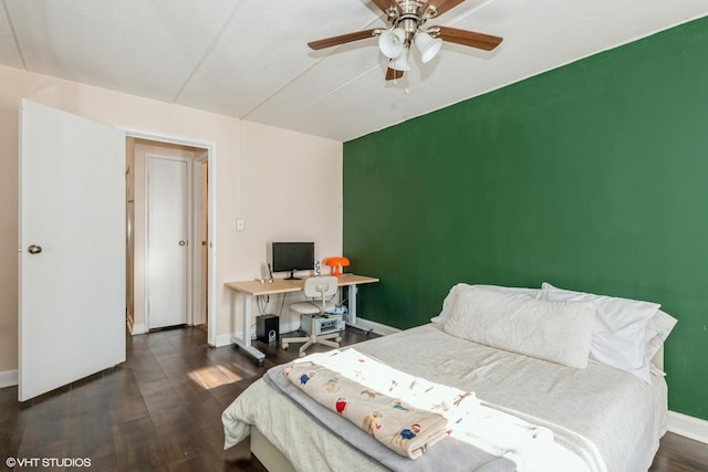 bedroom with ceiling fan and dark hardwood / wood-style flooring