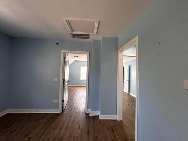 corridor featuring dark wood-type flooring