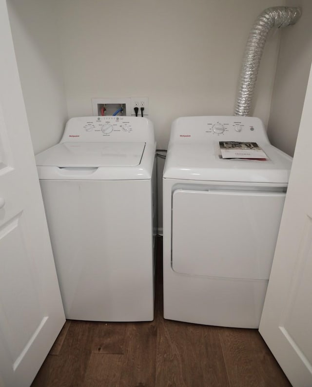 washroom featuring washer and clothes dryer and dark hardwood / wood-style floors