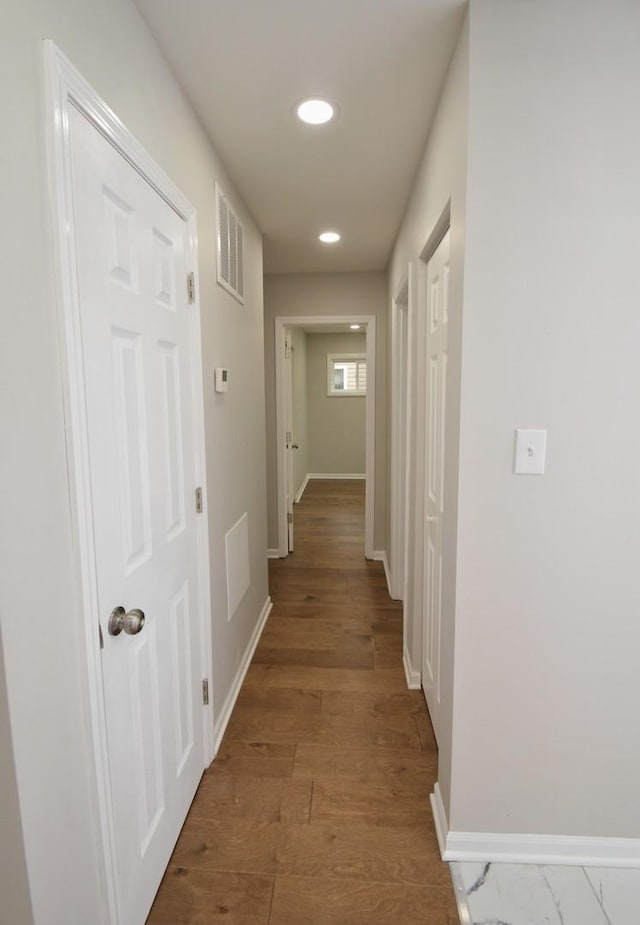 hallway featuring dark hardwood / wood-style flooring